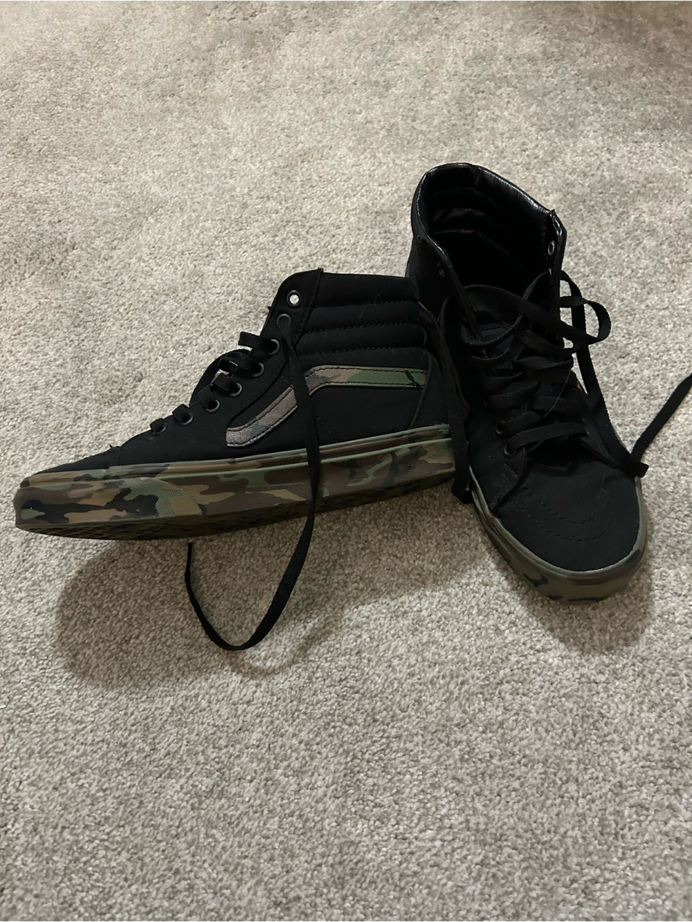 Vans High Top Sneakers in Black with Camo Sole